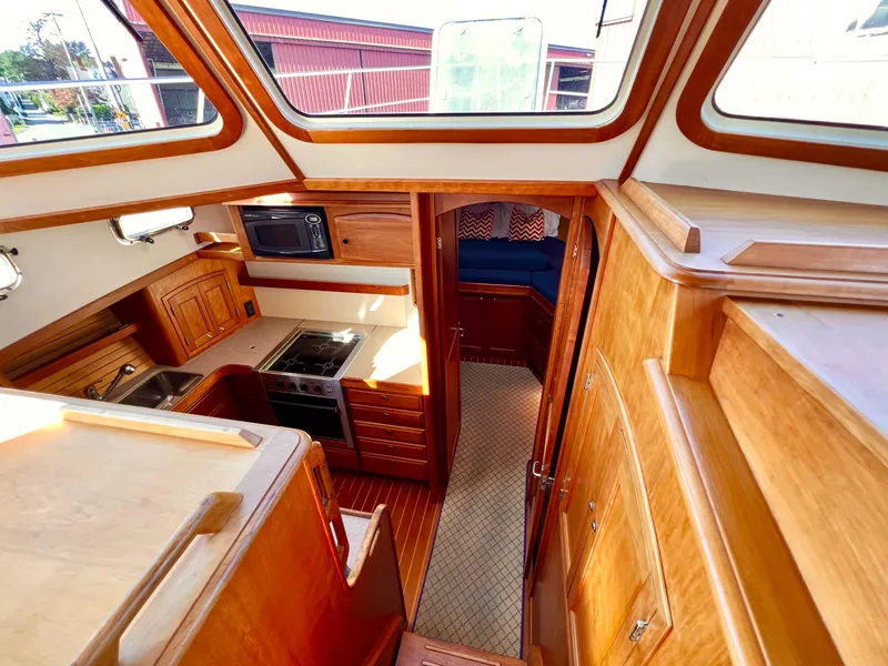 Slide: The Image of Interior of 2001 Sabre Sabreline 47 yacht with wooden cabinetry and modern kitchen. - 19