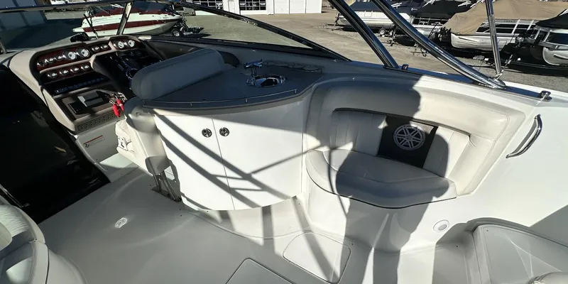 Slide: The Image of Interior of a 2006 Cobalt 323 boat with seating and control panel. - 14