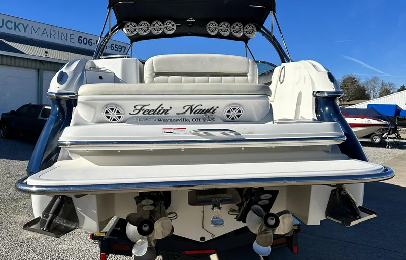 Slide: The Image of 2006 Cobalt 323 boat rear view at a marina. - 3