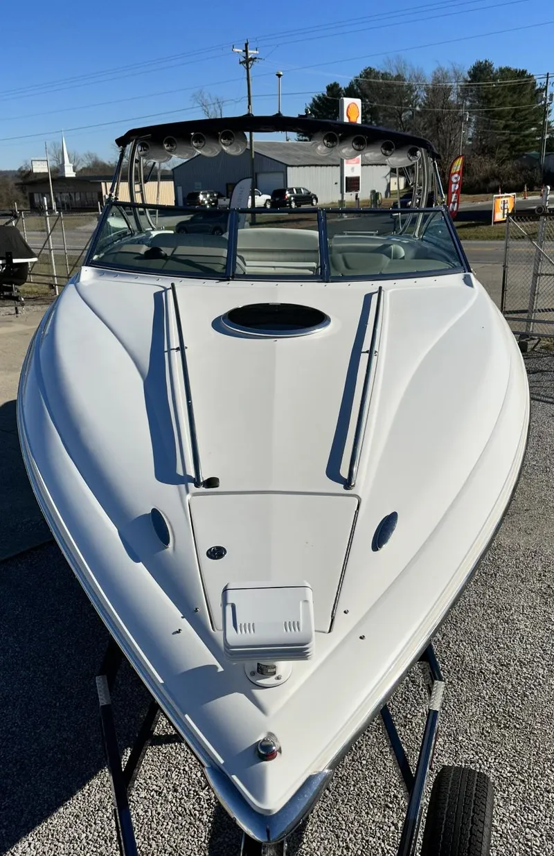Slide: The Image of 2006 Cobalt 323 boat, front view, docked in a marina. - 6