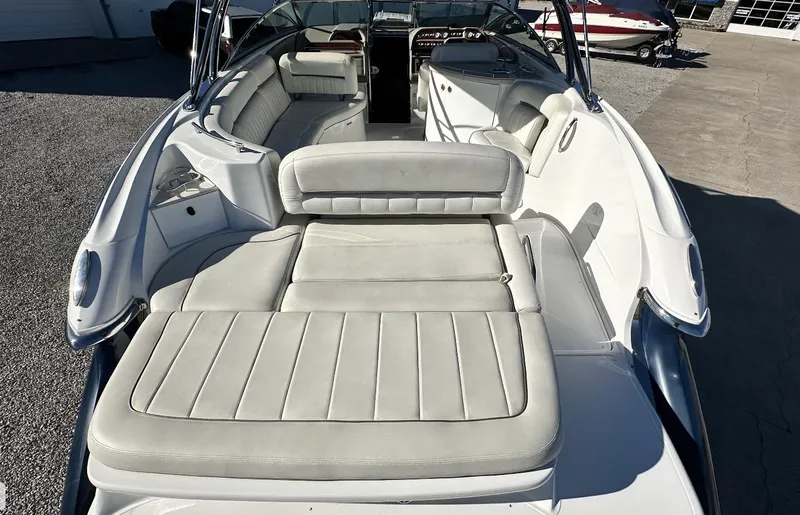 Slide: The Image of 2006 Cobalt 323 boat with spacious white leather seating. - 7
