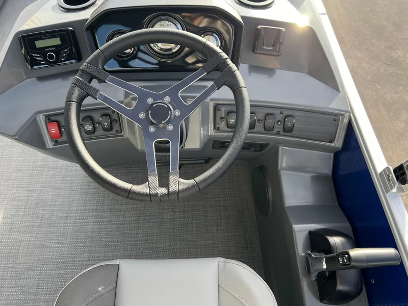 Slide: The Image of 2024 Bennington 188 SVL boat dashboard with steering wheel and control panel. - 6