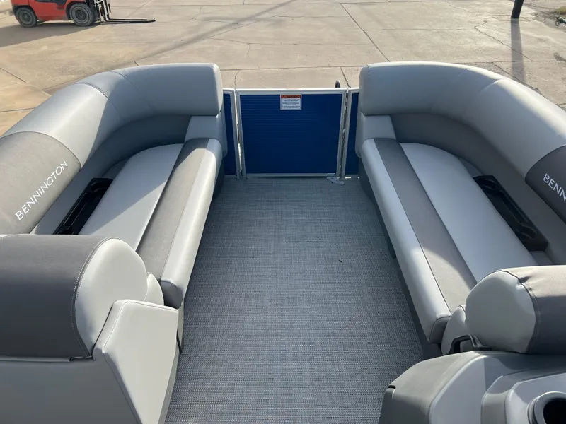 Slide: The Image of 2024 Bennington 188 SVL pontoon boat interior with gray seating and flooring. - 7