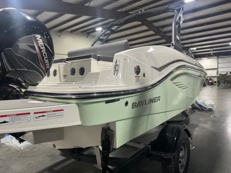 Slide: The Image of 2024 Bayliner DX2000 boat with Mercury outboard motor in a warehouse. - 5