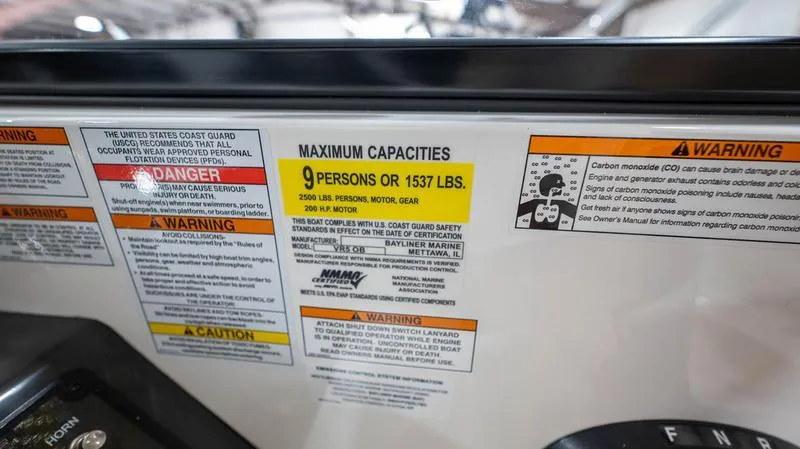 Slide: The Image of 2024 Bayliner VR5 Bowrider OB capacity label, maximum 9 persons or 1537 lbs. - 11