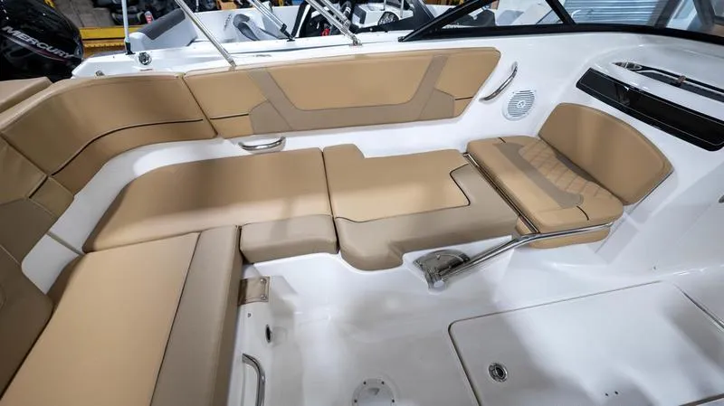 Slide: The Image of 2024 Bayliner VR5 Bowrider OB interior with tan seating and modern design. - 13