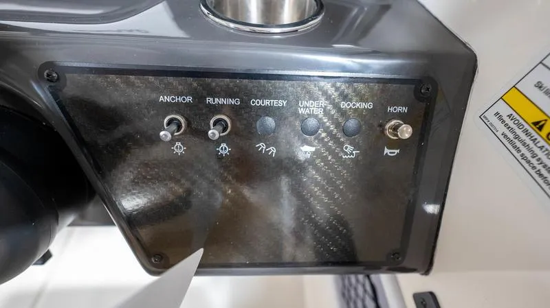 Slide: The Image of Control panel of 2024 Bayliner VR5 Bowrider OB with various switches and indicators. - 21