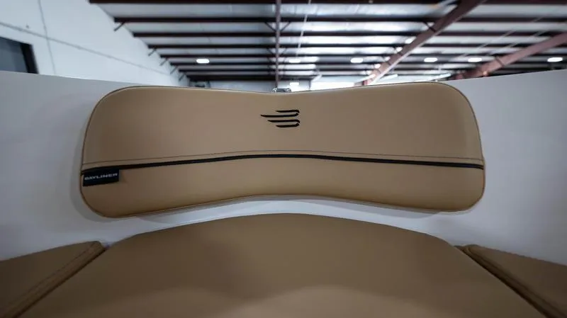 Slide: The Image of 2024 Bayliner VR5 Bowrider OB interior with tan upholstery and sleek design. - 26