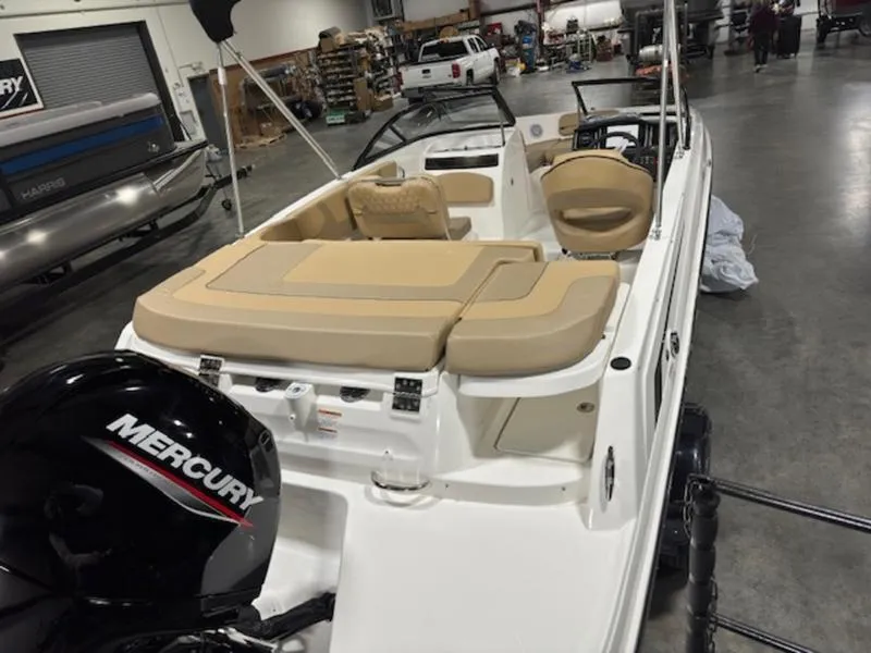 Slide: The Image of 2024 Bayliner VR5 Bowrider OB with Mercury engine in a showroom setting. - 5