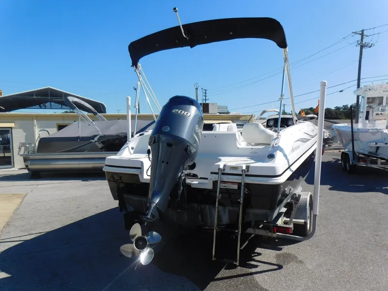 Slide: The Image of 2014 Hurricane Sport 188 boat with outboard motor and canopy. - 4