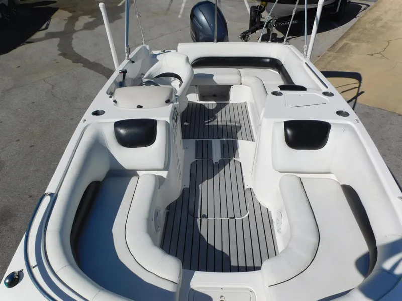 Slide: The Image of 2014 Hurricane Sport 188 boat interior with white seating and gray flooring. - 6