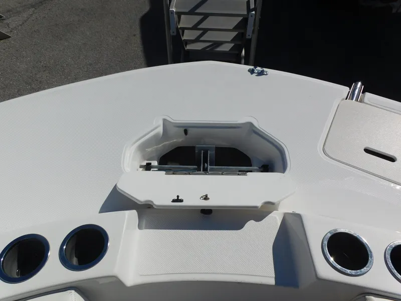 Slide: The Image of 2014 Hurricane Sport 188 boat deck with cup holders and storage compartment. - 8