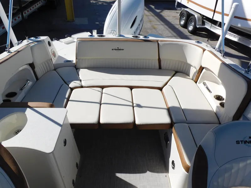 Slide: The Image of 2024 Stingray 231 DC boat interior with spacious seating and modern design. - 12