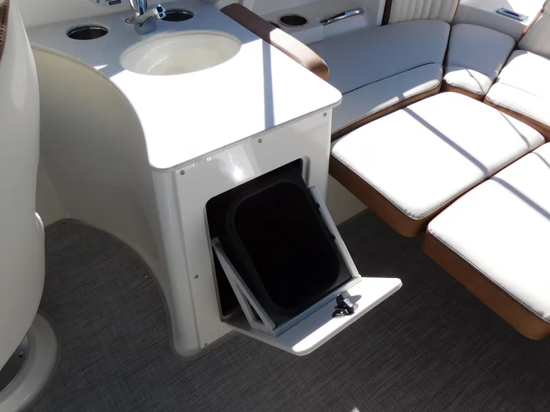 Slide: The Image of 2024 Stingray 231 DC boat interior with sink and seating area. - 14