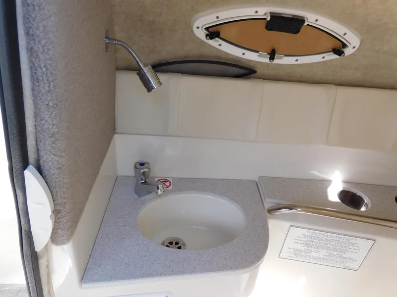 Slide: The Image of 2024 Stingray 231 DC boat interior sink and faucet. - 25