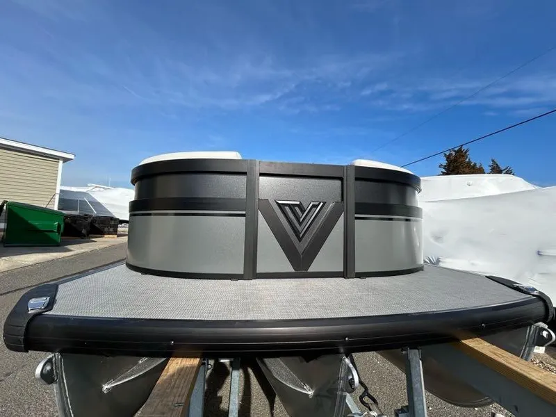 Slide: The Image of Viaggio d22q 2024 pontoon boat front view under clear blue sky. - 1