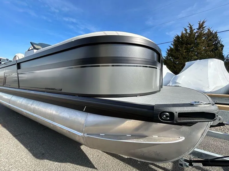Slide: The Image of 2024 Viaggio d22q pontoon boat with sleek silver and black design. - 4
