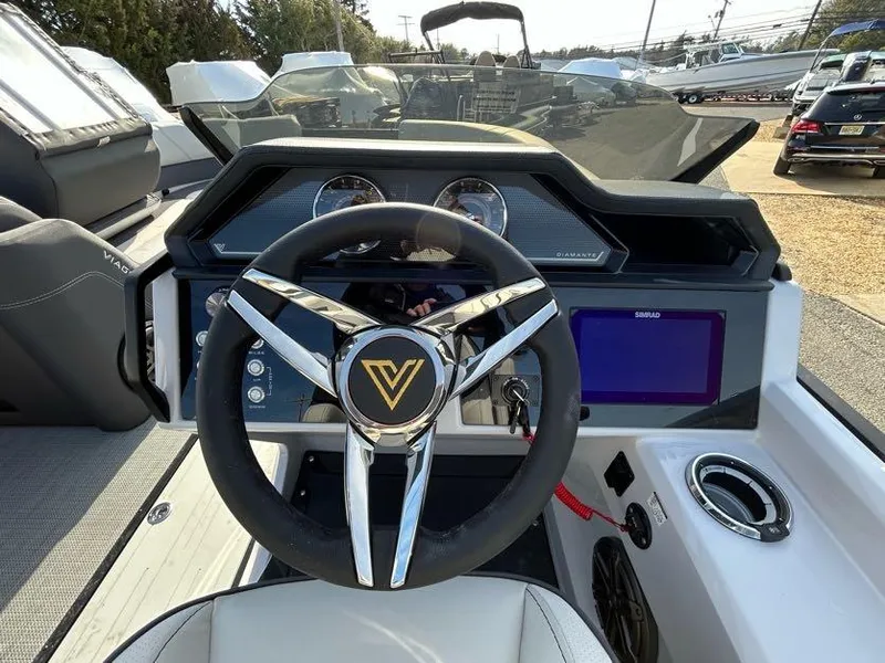 Slide: The Image of Viaggio d22q 2024 boat dashboard with steering wheel and control panel. - 8
