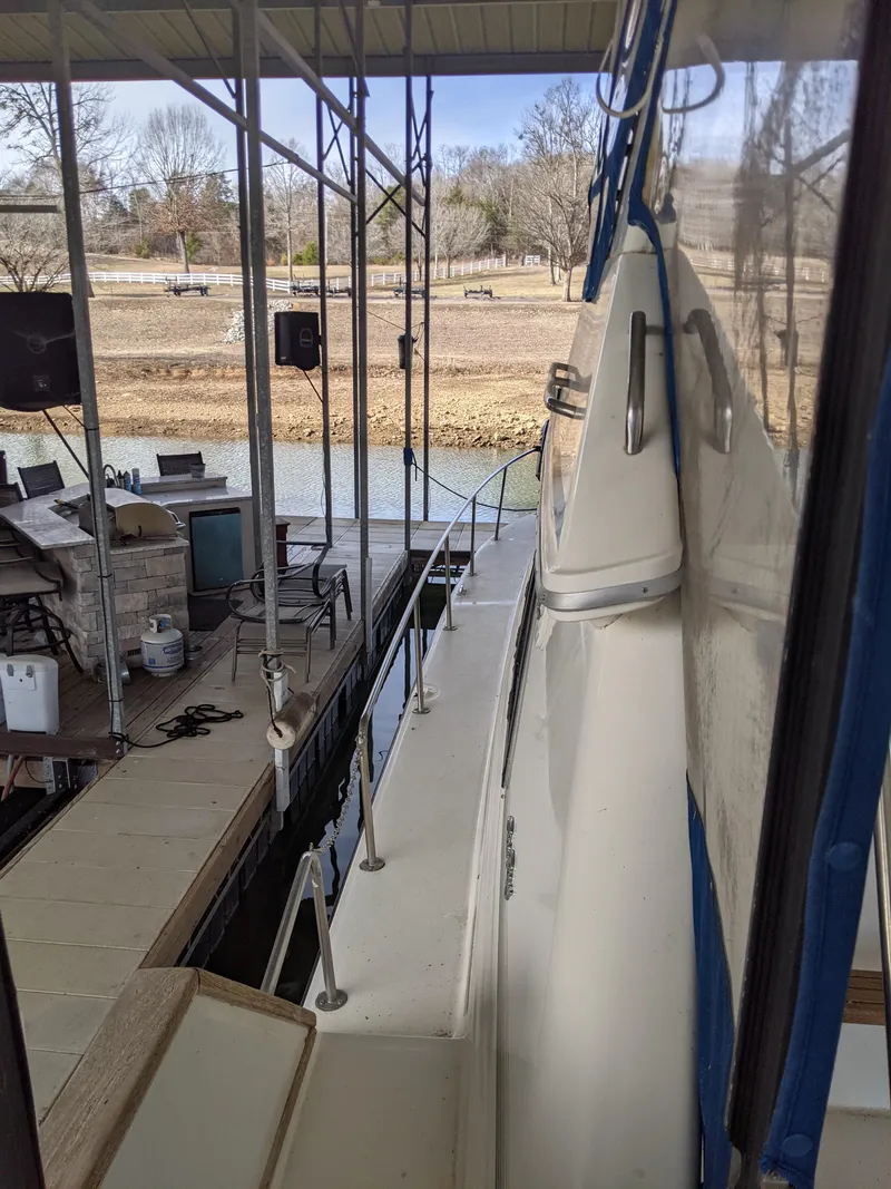 Slide: The Image of 1989 Sea Ray 380 Aft Cabin docked at a marina. - 10