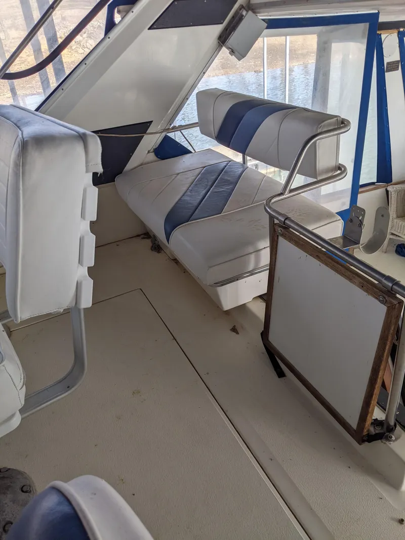 Slide: The Image of Interior seating area of a 1989 Sea Ray 380 Aft Cabin boat. - 14