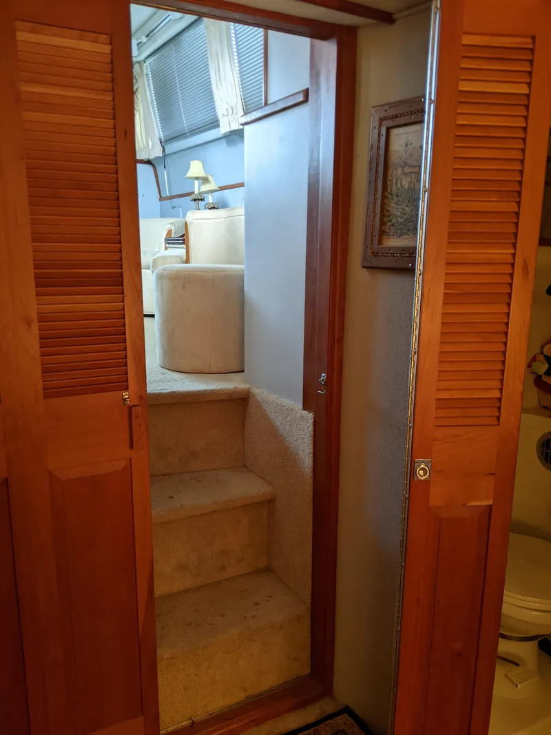 Slide: The Image of Interior stairs of 1989 Sea Ray 380 Aft Cabin yacht with wooden doors. - 23