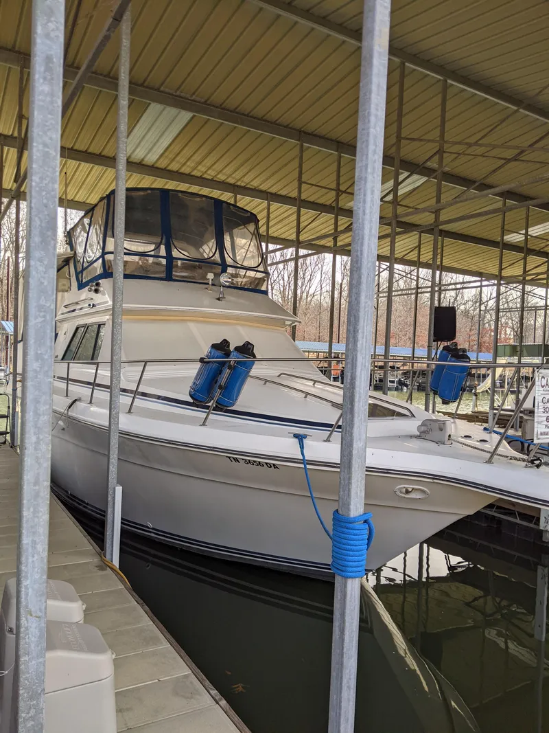 Slide: The Image of 1989 Sea Ray 380 Aft Cabin yacht docked in a covered marina. - 3
