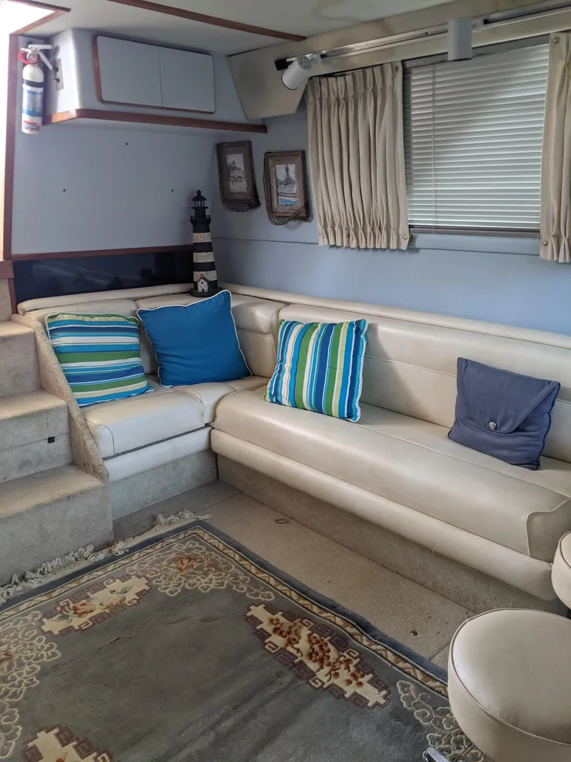 Slide: The Image of Interior of 1989 Sea Ray 380 Aft Cabin with cozy seating and nautical decor. - 35