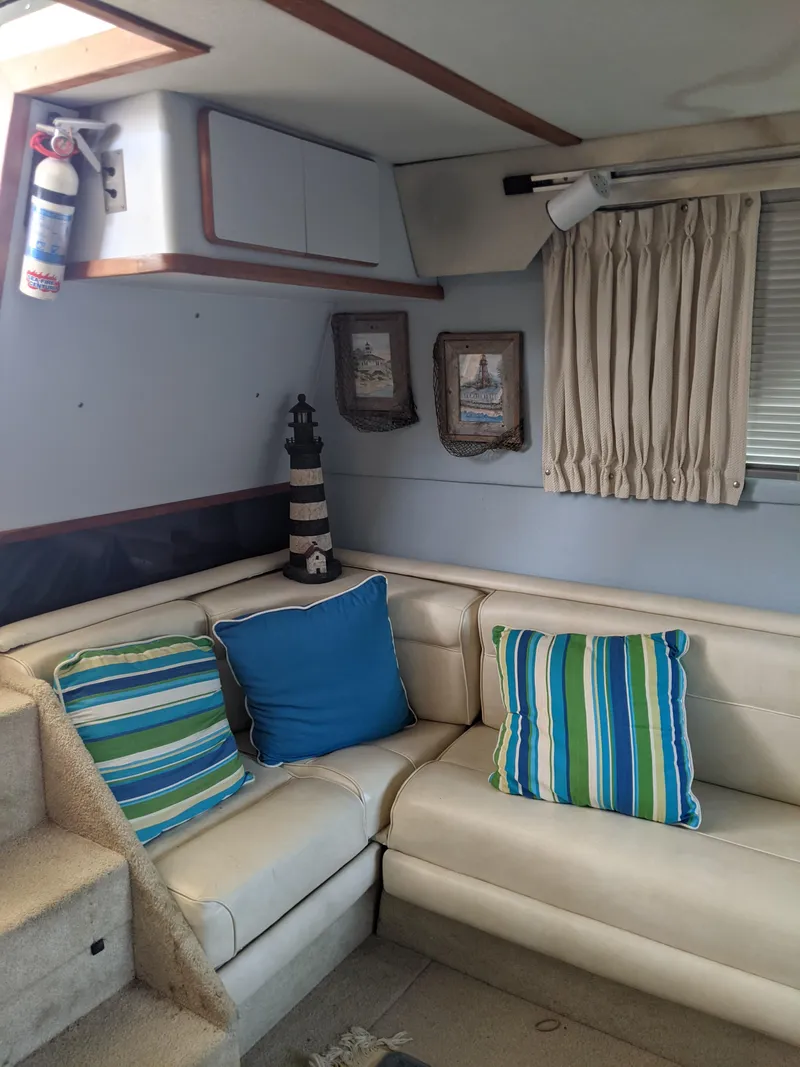 Slide: The Image of Interior of 1989 Sea Ray 380 Aft Cabin with nautical decor and striped pillows. - 37