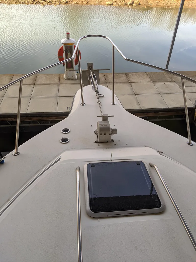 Slide: The Image of 1989 Sea Ray 380 Aft Cabin boat bow view at dock. - 9