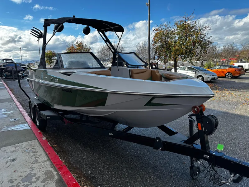 Slide: The Image of 2021 Axis T22 boat on trailer in parking lot. - 13