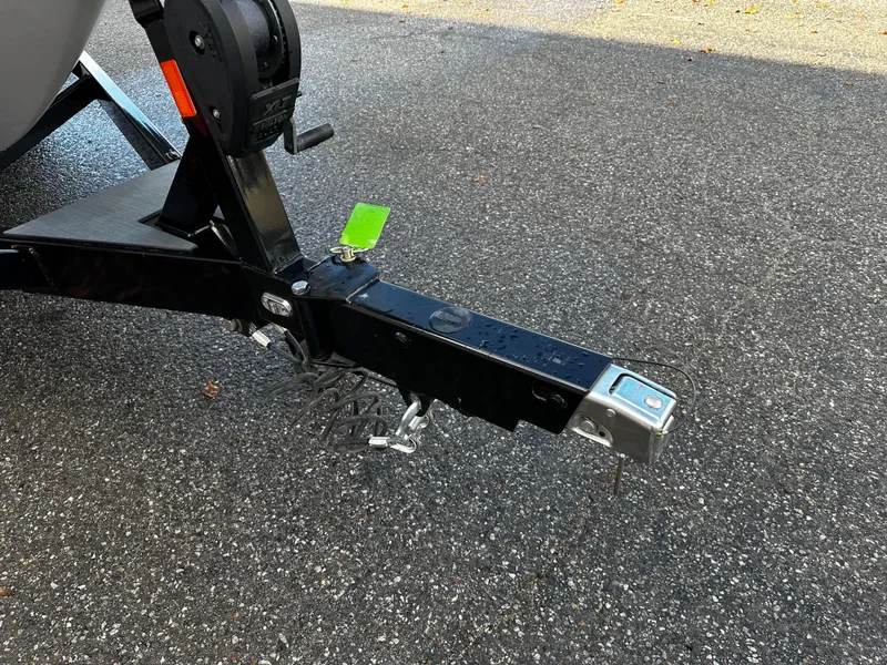 Slide: The Image of Trailer hitch of a 2021 Axis T22 boat on asphalt. - 14