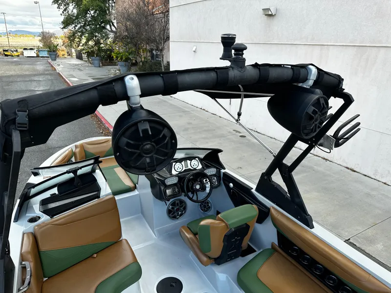 Slide: The Image of 2021 Axis T22 boat interior with speakers and dashboard controls. - 21
