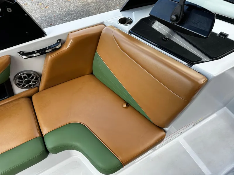 Slide: The Image of 2021 Axis T22 boat interior with tan and green seating. - 23