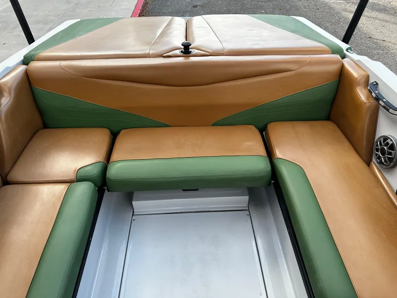 Slide: The Image of 2021 Axis T22 boat interior with green and tan seating. - 25