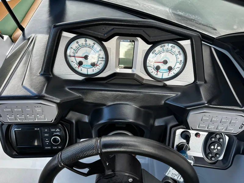 Slide: The Image of Dashboard of a 2021 Axis T22 boat with gauges and controls. - 27