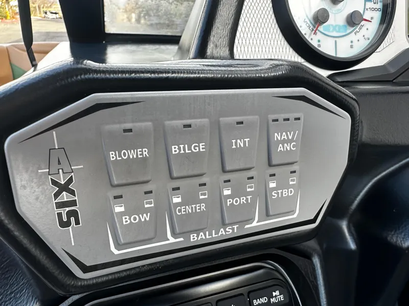 Slide: The Image of Control panel of a 2021 Axis T22 boat with various switches. - 31