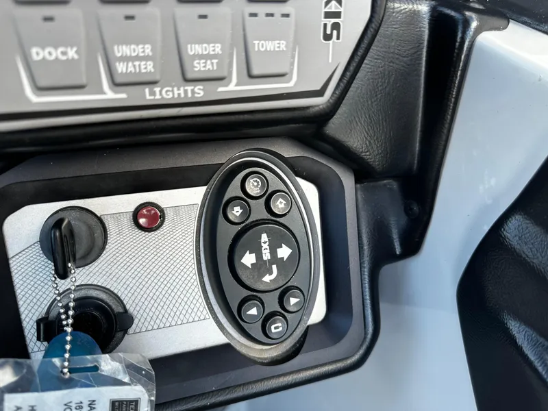 Slide: The Image of Control panel of a 2021 Axis T22 boat with various switches and buttons. - 33