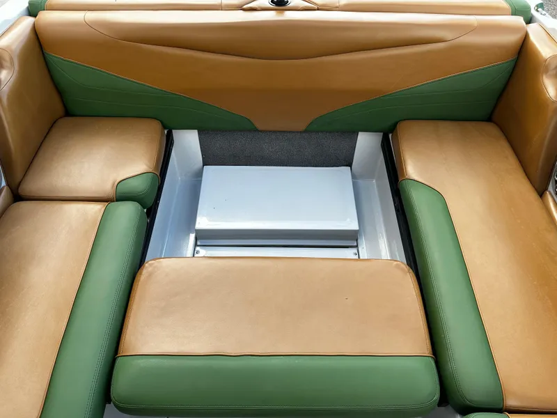 Slide: The Image of 2021 Axis T22 boat interior with tan and green cushioned seating. - 35