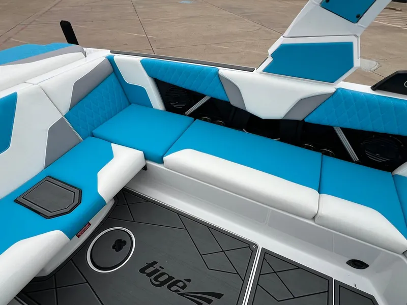 Slide: The Image of 2024 Tigé Z3 boat interior with blue and white seating, modern design. - 13
