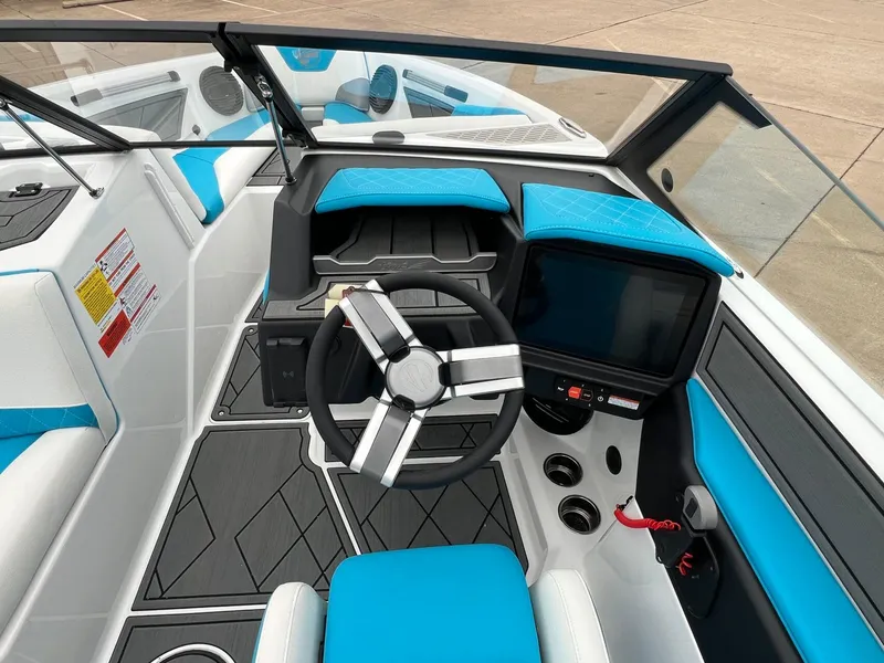 Slide: The Image of 2024 Tigé Z3 boat interior with modern dashboard and blue accents. - 16