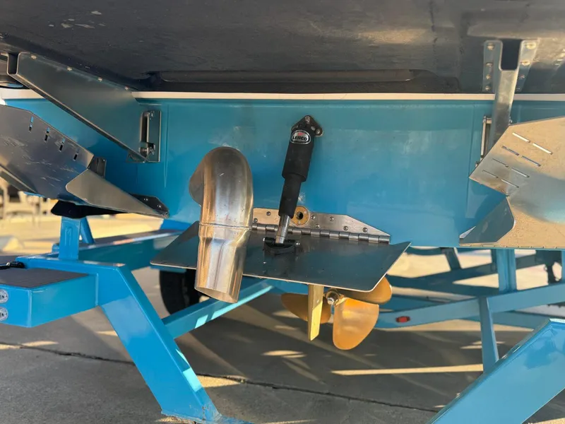 Slide: The Image of 2024 Tigé Z3 boat underside with propeller and exhaust system. - 6