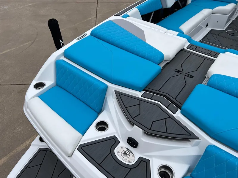 Slide: The Image of 2024 Tigé Z3 boat interior with blue and white seating, modern design. - 7