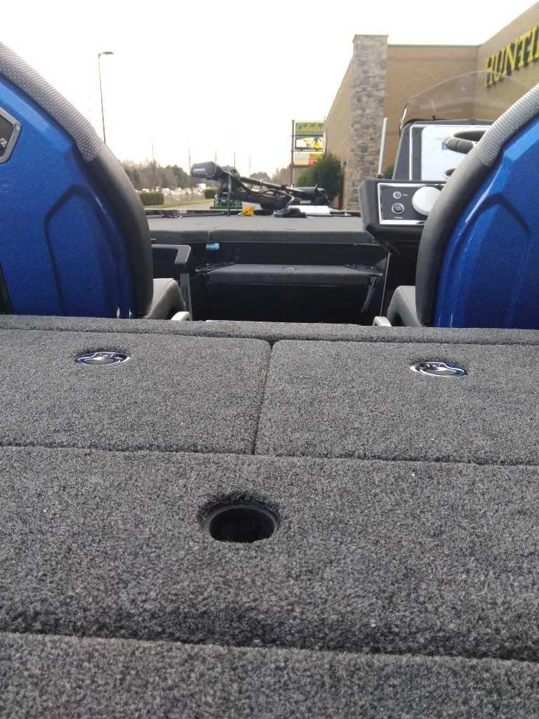 Slide: The Image of 2024 Ranger Z520R Ranger Cup Equipped boat interior with blue seats and carpeted deck. - 7