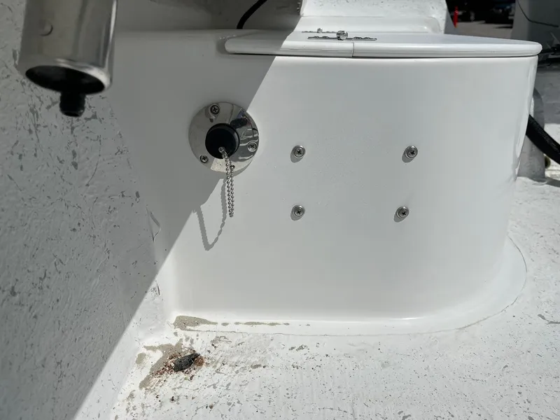 Slide: The Image of 2025 C-Hawk 23 Center Console boat detail showing a white console with metal fixtures. - 12