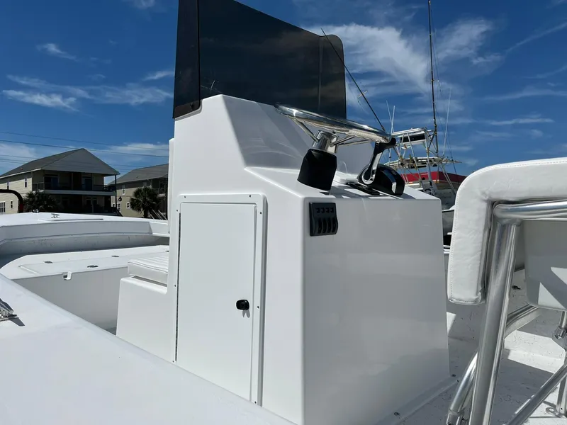 Slide: The Image of 2026 C-Hawk 23 Center Console boat with white seating and windshield. - 10