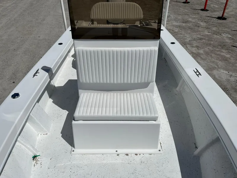 Slide: The Image of Battery compartment of 2026 C-Hawk 23 Center Console boat, featuring secured battery. - 15