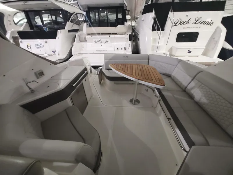 Slide: The Image of Interior of 2023 Sea Ray 320 Sundancer yacht with seating and table. - 20