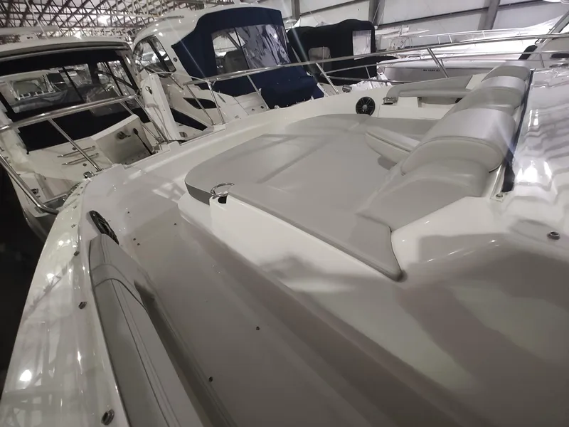 Slide: The Image of 2023 Sea Ray 320 Sundancer yacht interior with luxurious seating. - 23