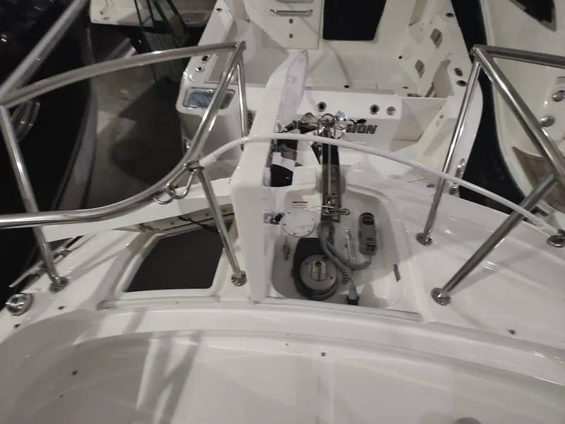 Slide: The Image of 2023 Sea Ray 320 Sundancer boat deck with stainless steel railings and control panel. - 25