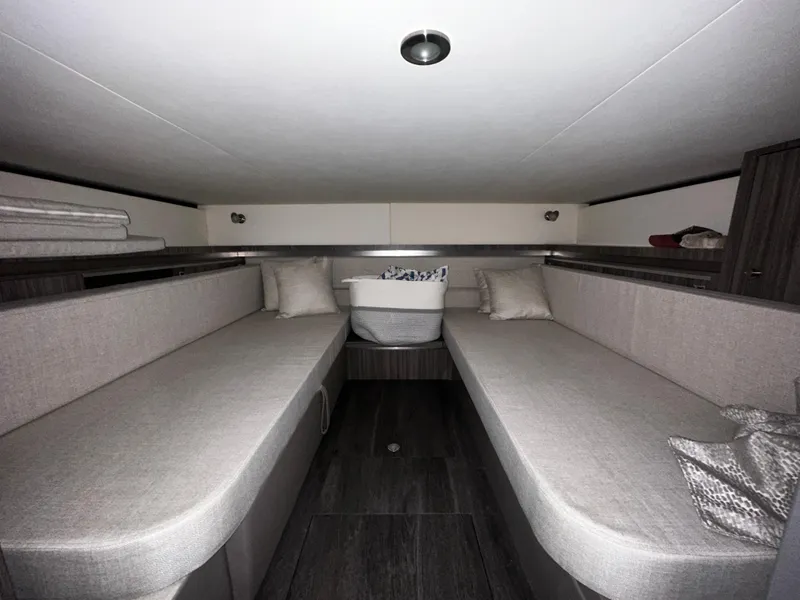 Slide: The Image of Interior cabin of 2023 Sea Ray 320 Sundancer yacht with twin seating. - 42